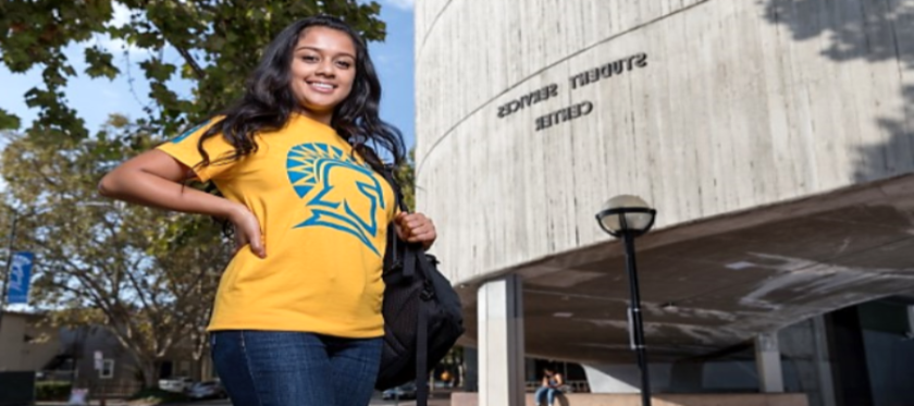 Student in front of the Student Services Center.